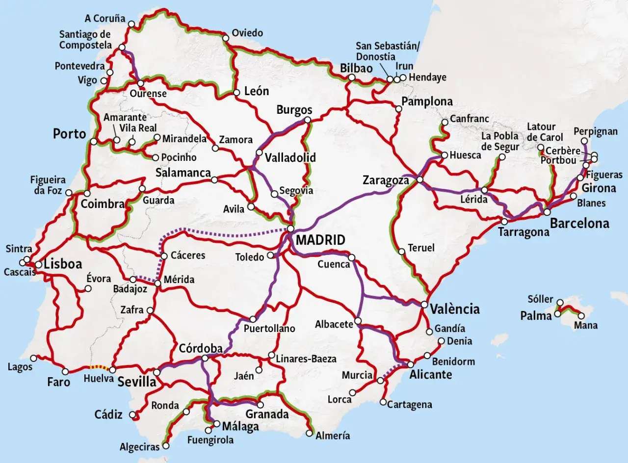 Mapa kolejowa Hiszpanii z zaznaczonymi trasami pociągów. Widoczne główne miasta jak Madryt, Barcelona, Walencja, Sewilla.